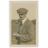 John 'Jack' White. Sepia real photograph postcard of white, half length wearing a cap, smoking a