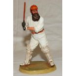 W.G. Grace. Royal Doulton china figure of W.G. Grace. Grace is depicted in batting mode wearing M.