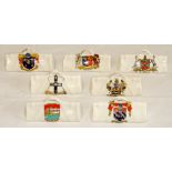 Crested cricket bags. Seven small crested china cricket bags with colour emblems for '