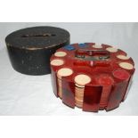 Boxed set of poker chips c.1920s, contained in circular bakelite container with central brass handle