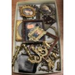 A box containing a collection of dolls house miniatures to include various portraitsCondition