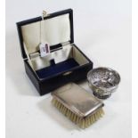 A modern silver backed hand-brush, in fitted leather case; together with a continental silver