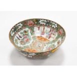 A Chinese Canton Famille Rose bowl typically decorated with various figures within a landscape