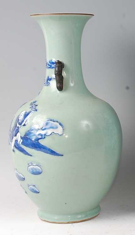 A Chinese export celadon ground baluster vase, having raised blue and white figure and cloud - Image 2 of 14