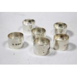 A set of three plain heavy silver napkin rings, maker Richard Woodman Burbage, London 1943; together