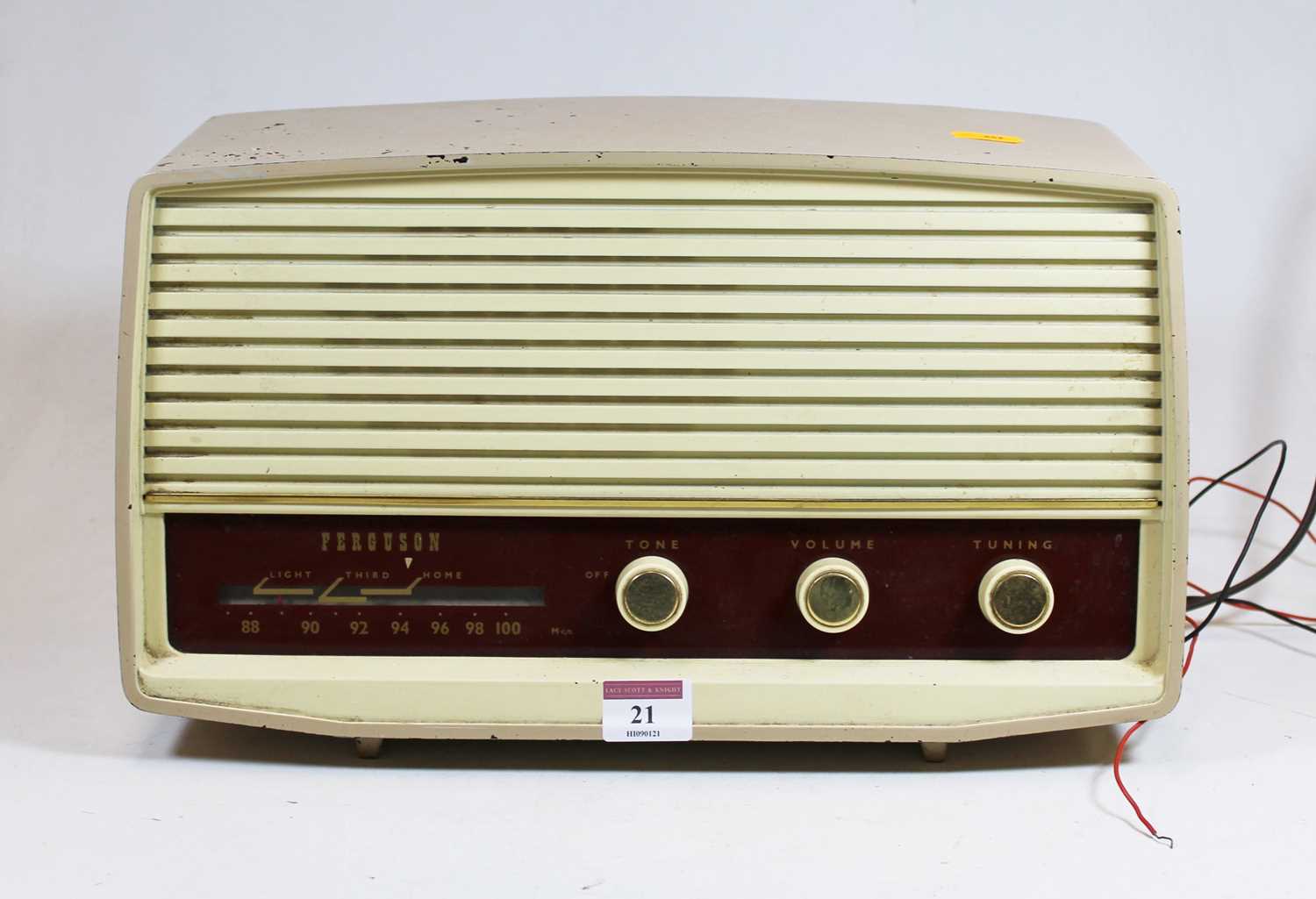 A 1950s Ferguson radio, housed in a beige painted metal case, w.37cmCondition report: See extra