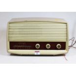 A 1950s Ferguson radio, housed in a beige painted metal case, w.37cmCondition report: See extra