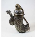 An Eastern white metal and brass mounted incense burner(?), the cover in the form of a mythical