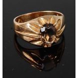 A 9ct yellow gold brown topaz dress ring, having an oval brown topaz in a heavy claw mount, topaz