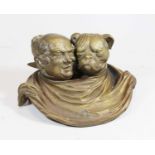 A reproduction bronzed desk stand, the twin inkwells each in the form of a man and dogs head, w.