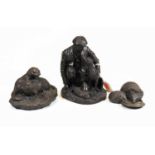 A Heredotus Ltd bronzed model of a man crouching with his dog, h.15cm; together with a similar model