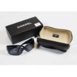 A pair of Chanel sunglasses, in original box