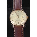 A gents Tissot Seastar-seven 9ct gold cased automatic wrist watch having signed champagne dial,