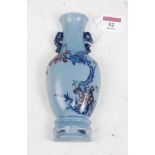 A Chinese export wall pocket in the form of a vase on blue ground decorated with birds amidst