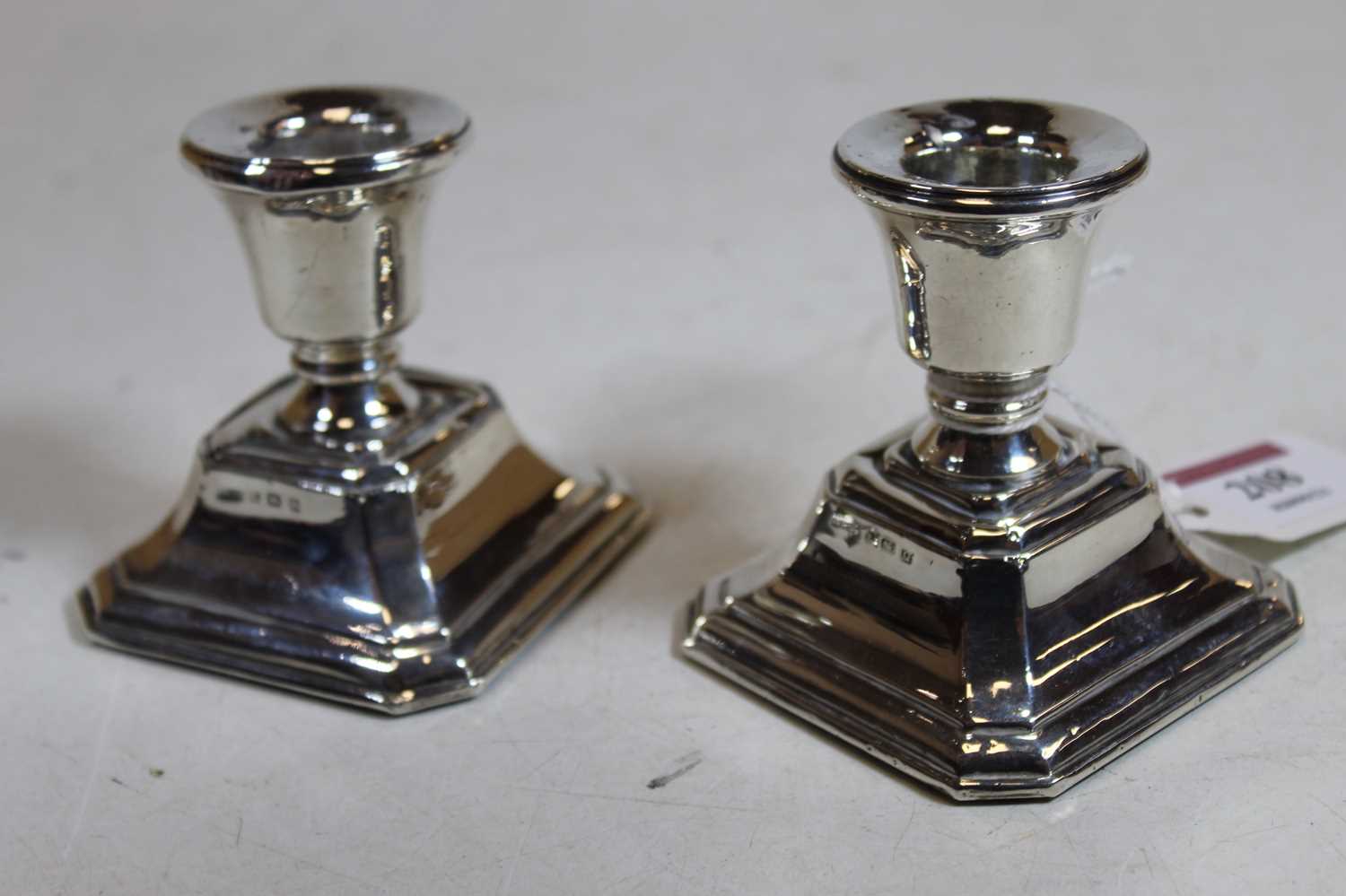A pair of George V silver dwarf table candlesticks, each on a loaded base, h. 7.5cmCondition report: - Image 3 of 15