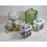 A small collection of miscellaneous items, to include novelty teapots, moulded glass biscuit