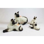 A Beswick figure of a Siamese cat standing model No. 1897 seal point gloss finish, together with