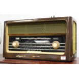 A 1950s Polish Calypso 62015 radio, housed in a walnut case, w.55cmCondition report: No plug, so