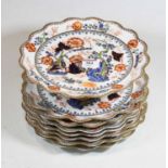 A 19th century Coalport part dessert service, decorated with a dragon amidst flowers and foliage,
