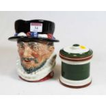 A Royal Doulton Beefeater character jug, h.17cm; together with a Devon pottery tobacco jar and cover
