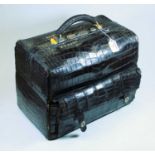 A black snakeskin clad travel case (a/f)