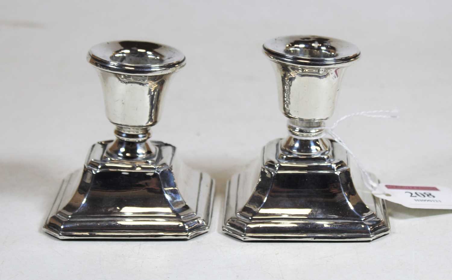 A pair of George V silver dwarf table candlesticks, each on a loaded base, h. 7.5cmCondition report: