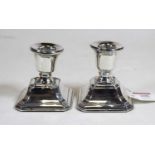 A pair of George V silver dwarf table candlesticks, each on a loaded base, h. 7.5cmCondition report: