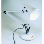 A modern white painted angle poise desk lamp