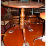 A 19th century provincial oak and fruitwood circular tilt-top pedestal tripod table, dia.73cm
