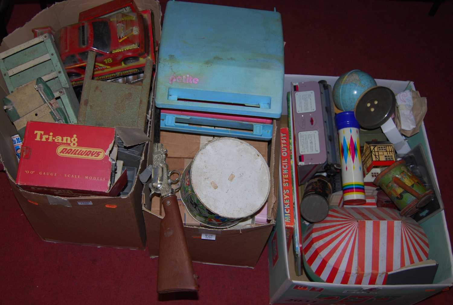 Three boxes of various toys including a Mettoy typewriter, tinplate till, etc
