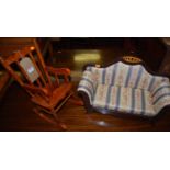 A stained wood dolls rocking armchair; together with an upholstered two-seater dolls sofa (2)