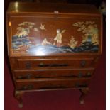 An early 20th century walnut and chinoiserie decorated slopefront three drawer writing bureau, on