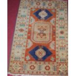 A Persian woollen Kazak rug, 116 x 75cmCondition report: Rather grubby. Tassles mostly missing.