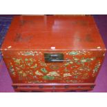 A Chinese red lacquered hardwood and gilt floral decorated hinge-top chest, having three short lower