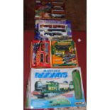 A boxed Matchbox train set, a North Pole Holiday Express boxed train set, and three various others