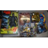 A Planet of the Apes boxed figure, a Doctor Who boxed figure, Stormbreaker boxed figure, and a