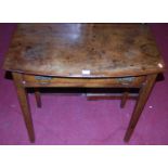An early 19th century provincial mahogany bowfront single drawer side table, w.76.5cm