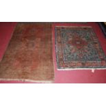 A Persian woollen Tabriz rug, 126 x 103cm; together with a Persian woollen red ground Bokhara rug (