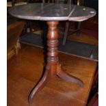 A 19th century provincial oak circular tilt-top pedestal tripod table, dia.59cm