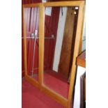 Three early 20th century light oak mirrored wardrobe doors, overall dimensions 165 x