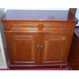 A late Victorian walnut chiffonier, having twin frieze drawers over twin panelled doors, w.105cm
