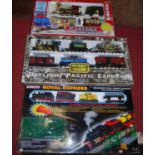 A boxed Royal Express train set, a Hobby boxed train set, and a modern Western Express boxed train