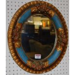 A moulded plaster floral and gilt painted oval wall mirror, 39 x 33cm