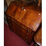 A mid-Victorian mahogany, flame mahogany, and further crossbanded slopefront four drawer writing