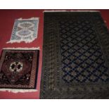 A Persian woollen blue ground Bokhara rug, having multiple trailing tramline borders, 190 x 122cm;