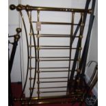 A contemporary polished brass framed kingsize bedstead, in the Victorian taste, with side-rails,