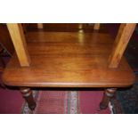 A Victorian walnut extending dining table, the top having three extra leaves and wind-out action,
