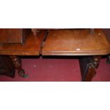 A mid-Victorian mahogany round cornered extending dining table, having wind-out action, two extra