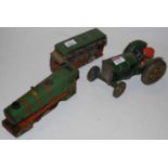 A 20th century tinplate tractor; a 20th century clockwork and tinplate locomotive; and an early 20th