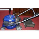 A Hyundai 139cc petrol driven lawn-mower, with grass collecting box